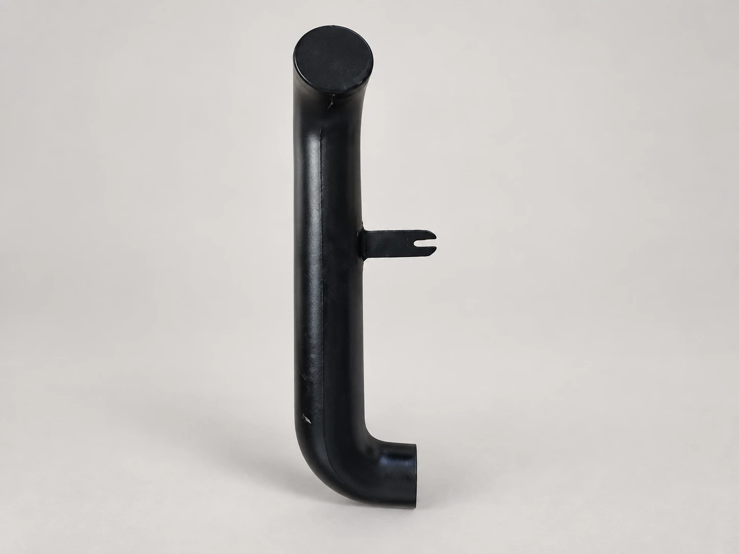 Molded tube with an integral bracket